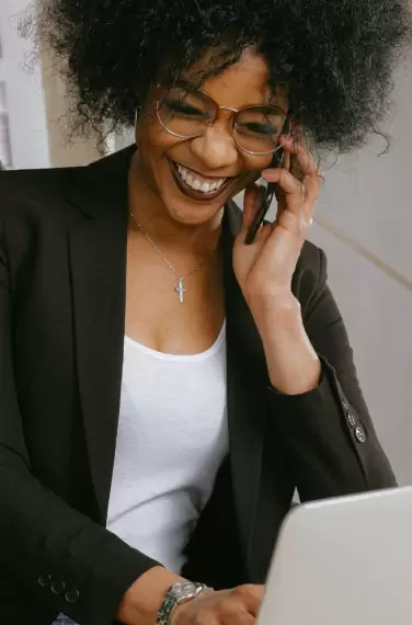 low view confident woman holding camera